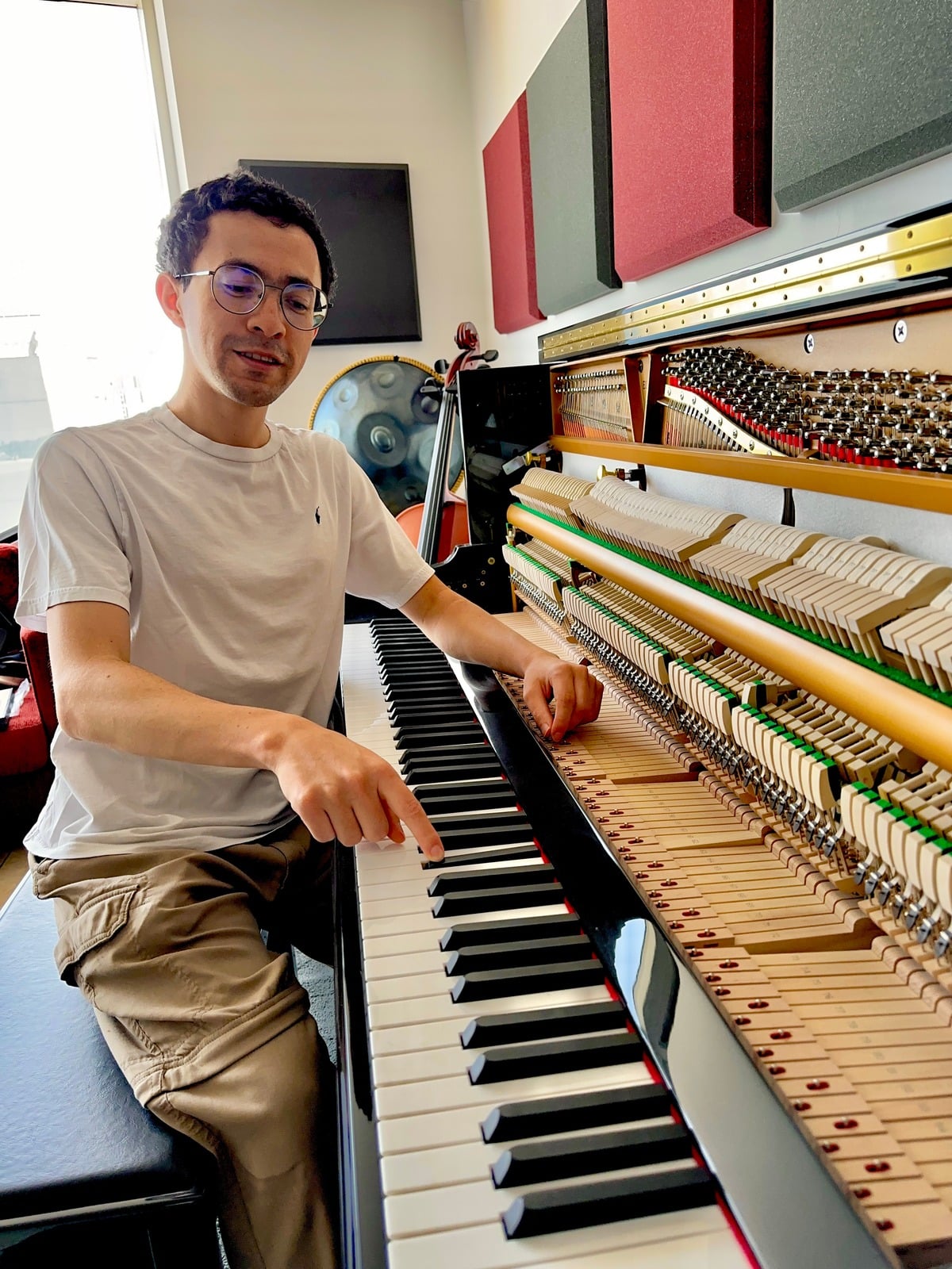 Mauricio Trabanino at the piano in his studio